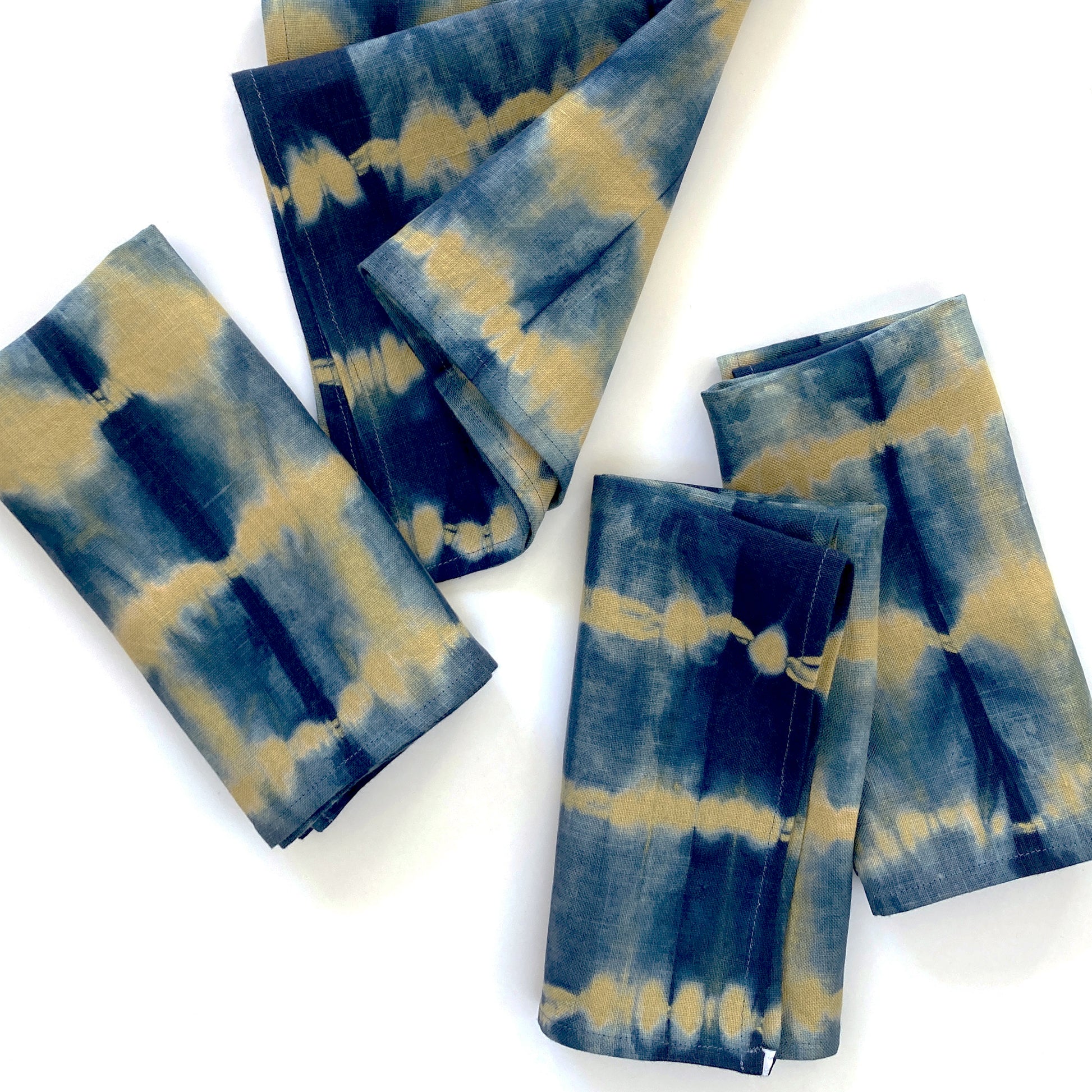 Gold mustard linen napkins, set of four, dyed with indigo in Pleat pattern. Sustainably hand-dyed in small batches and sewn in New York City.