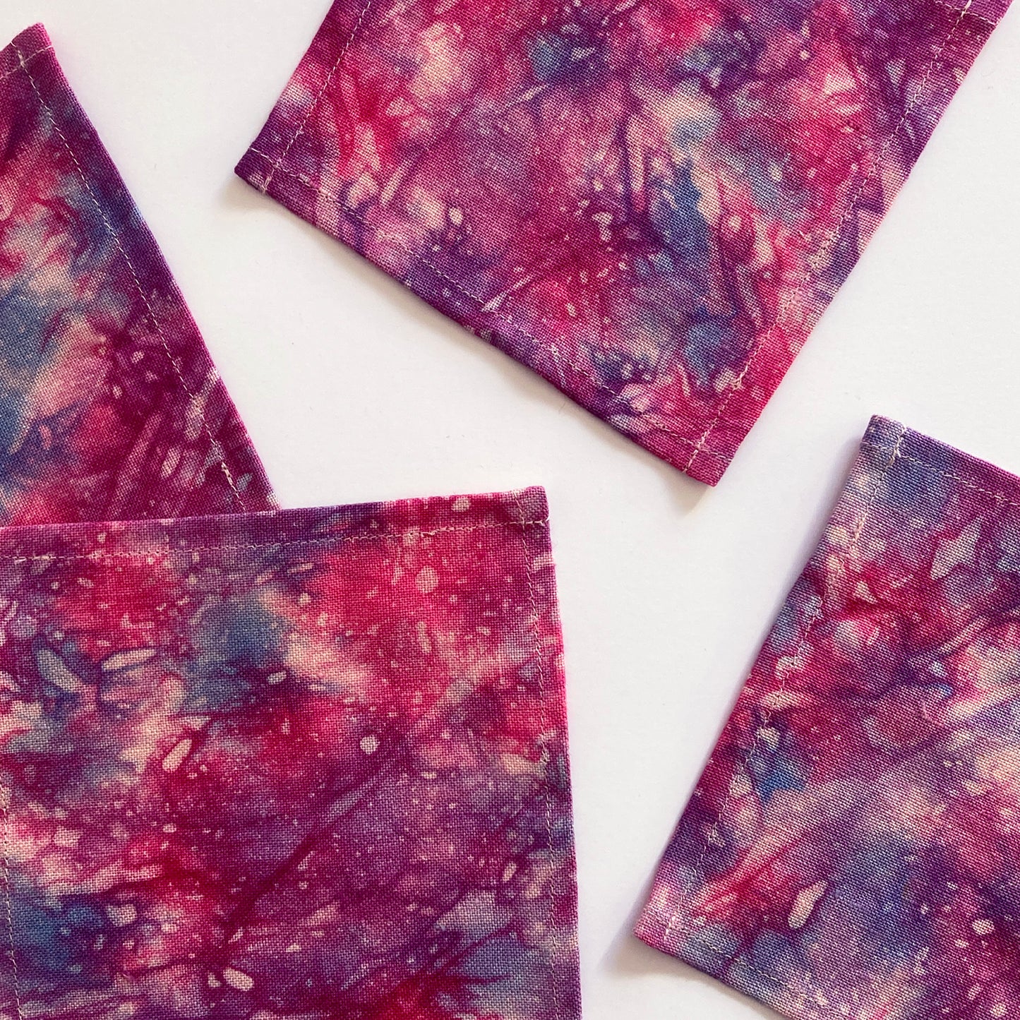 Nightfall pink linen cocktail napkins, set of four. Beautifully merging magenta, orange and lavender dyes on linen. Sustainably hand-dyed in small batches and sewn in New York City.