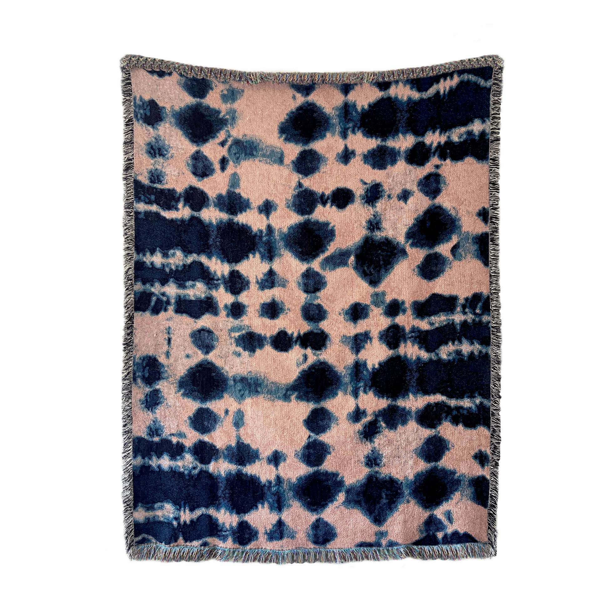 Rose pink and indigo blue woven cotton throw blanket with fringed edges, in abstract Inkblot pattern. 54 by 72 inches.