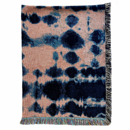 Rose pink and indigo blue woven cotton throw blanket with fringed edges, in abstract Inkblot pattern. 54 by 72 inches.