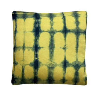 Canary yellow silk pillow dyed with indigo, in abstract grid pattern.